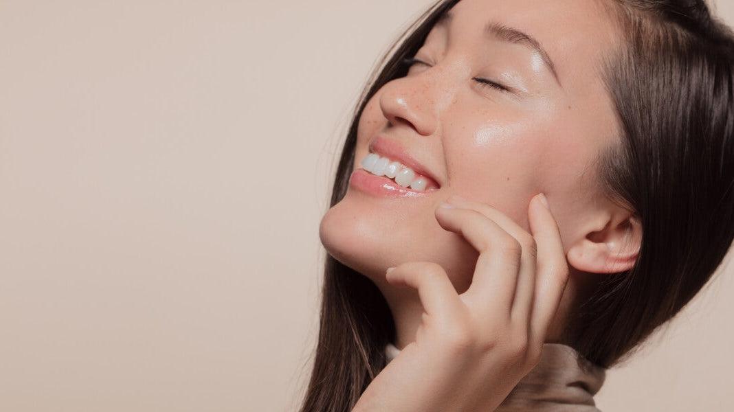 Bride applying skincare as part of a wedding skin prep routine for glowing, radiant skin