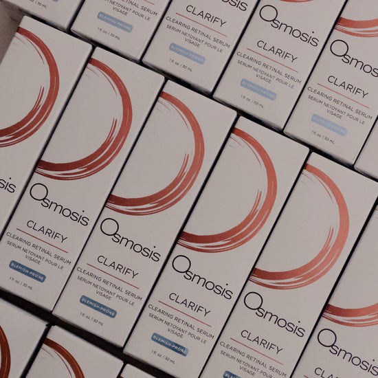 Multiple boxes of Osmosis Clarify product arranged in rows.