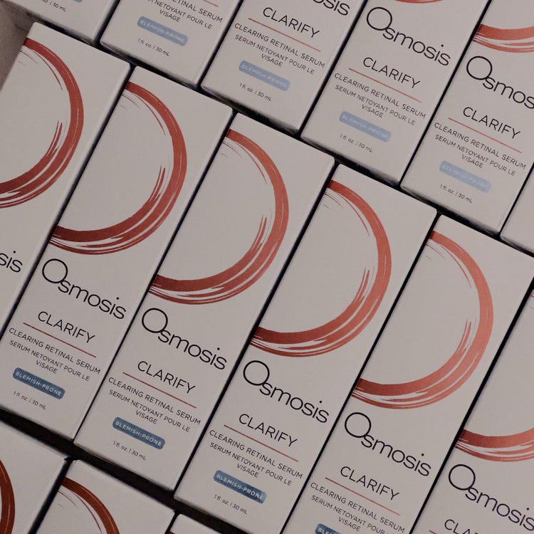 Multiple boxes of Osmosis Clarify product arranged in rows.